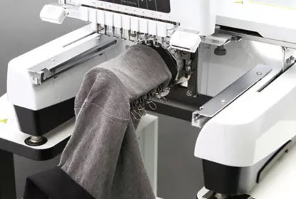 Polo shirt on cylinder frame in embroidery machine